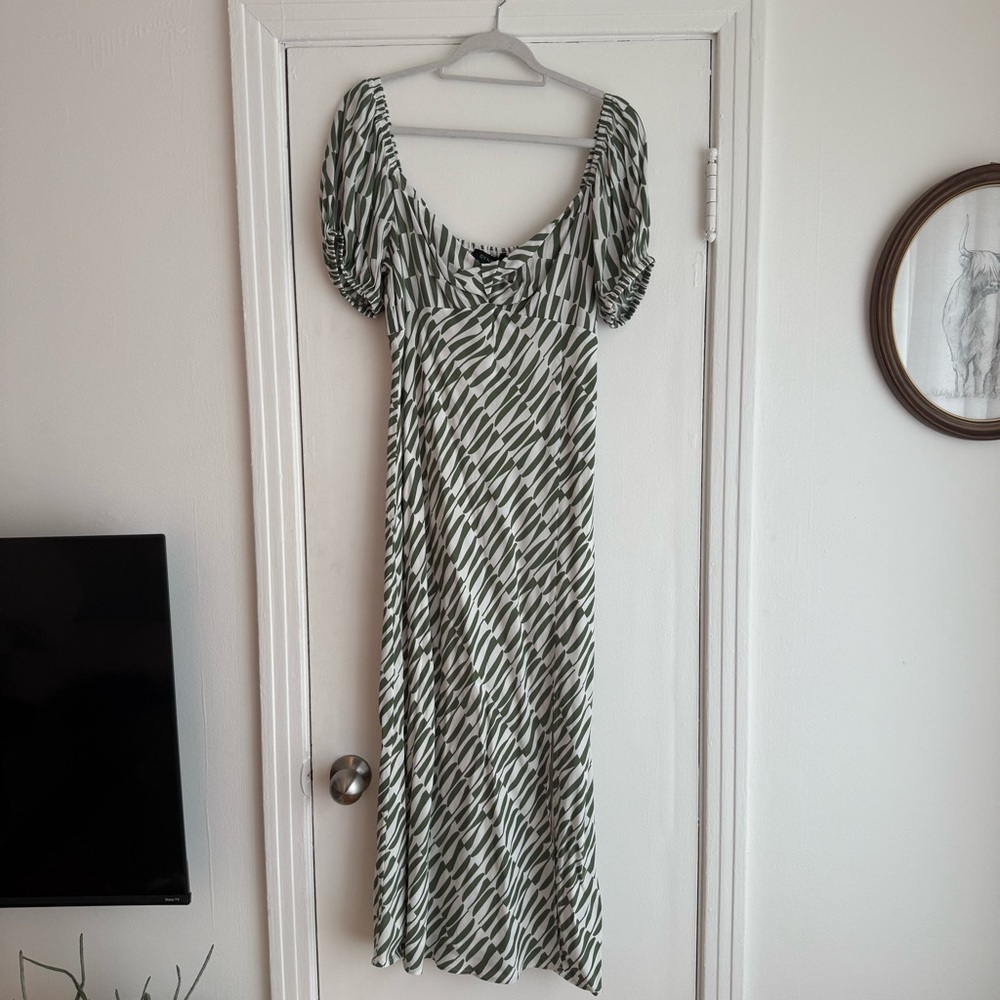 Dynamite Dress with front twist and abstract green pattern